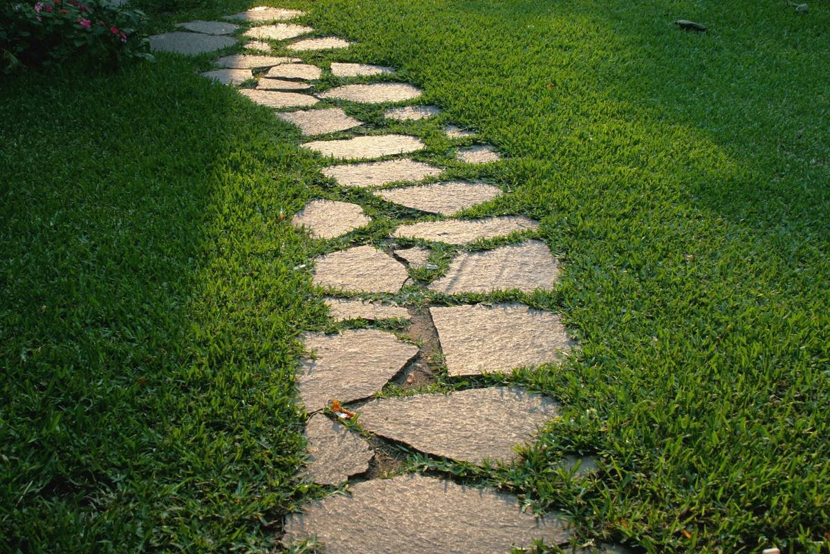 Eco-friendly edging for gardens ideas using reclaimed bricks and natural stone