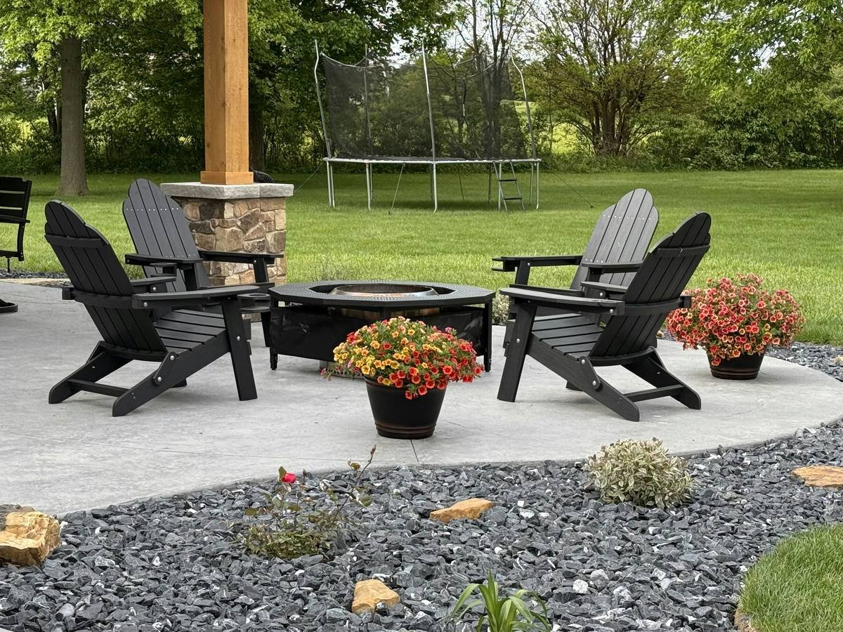 Steel and stone edging for gardens and landscaping installed along a curved flower bed with mulch and perennials